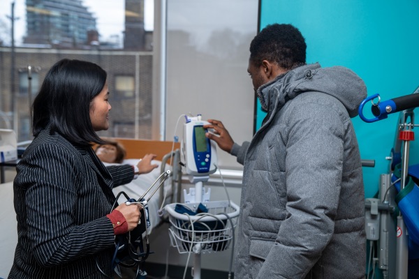 Students checking medical equipment.