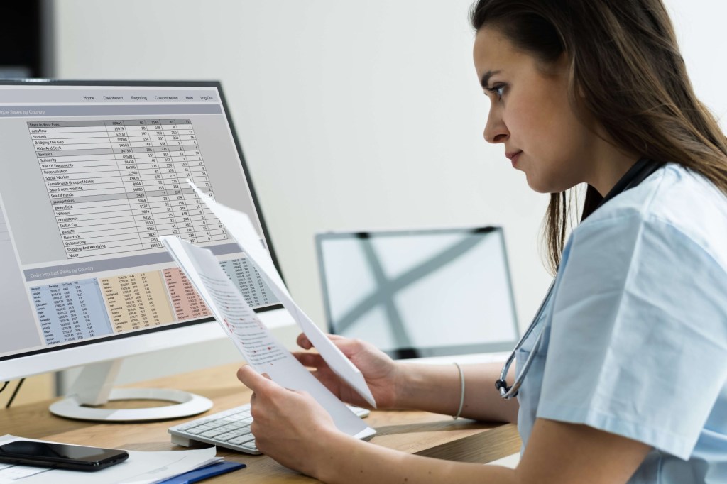 Doctor looking at reports